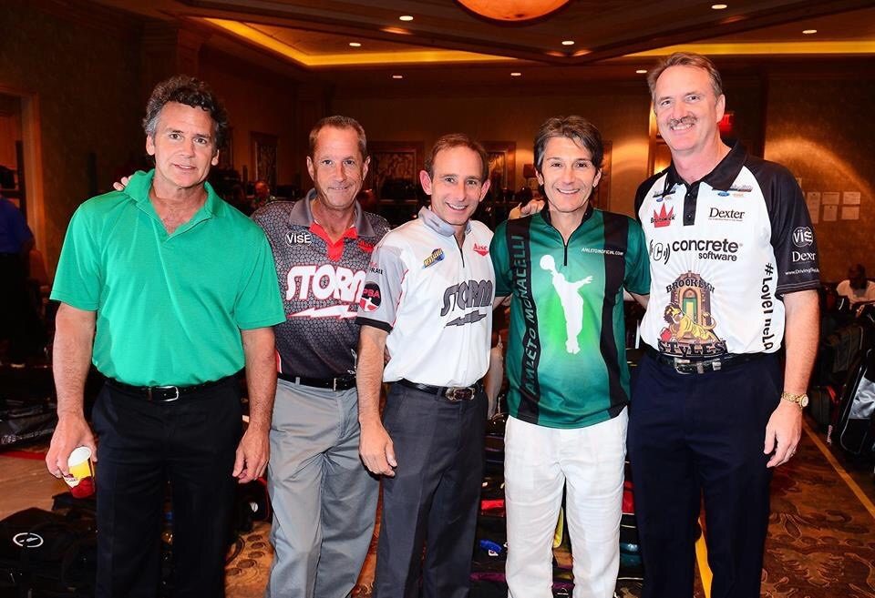 Amleto Monacelli with fellow professionals wearing his own mark